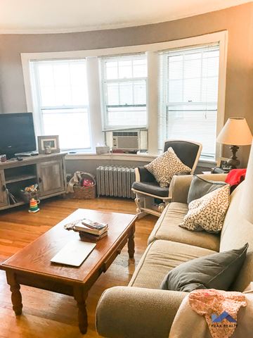 Evanston apartment for rent - a living room with a couch and a coffee table